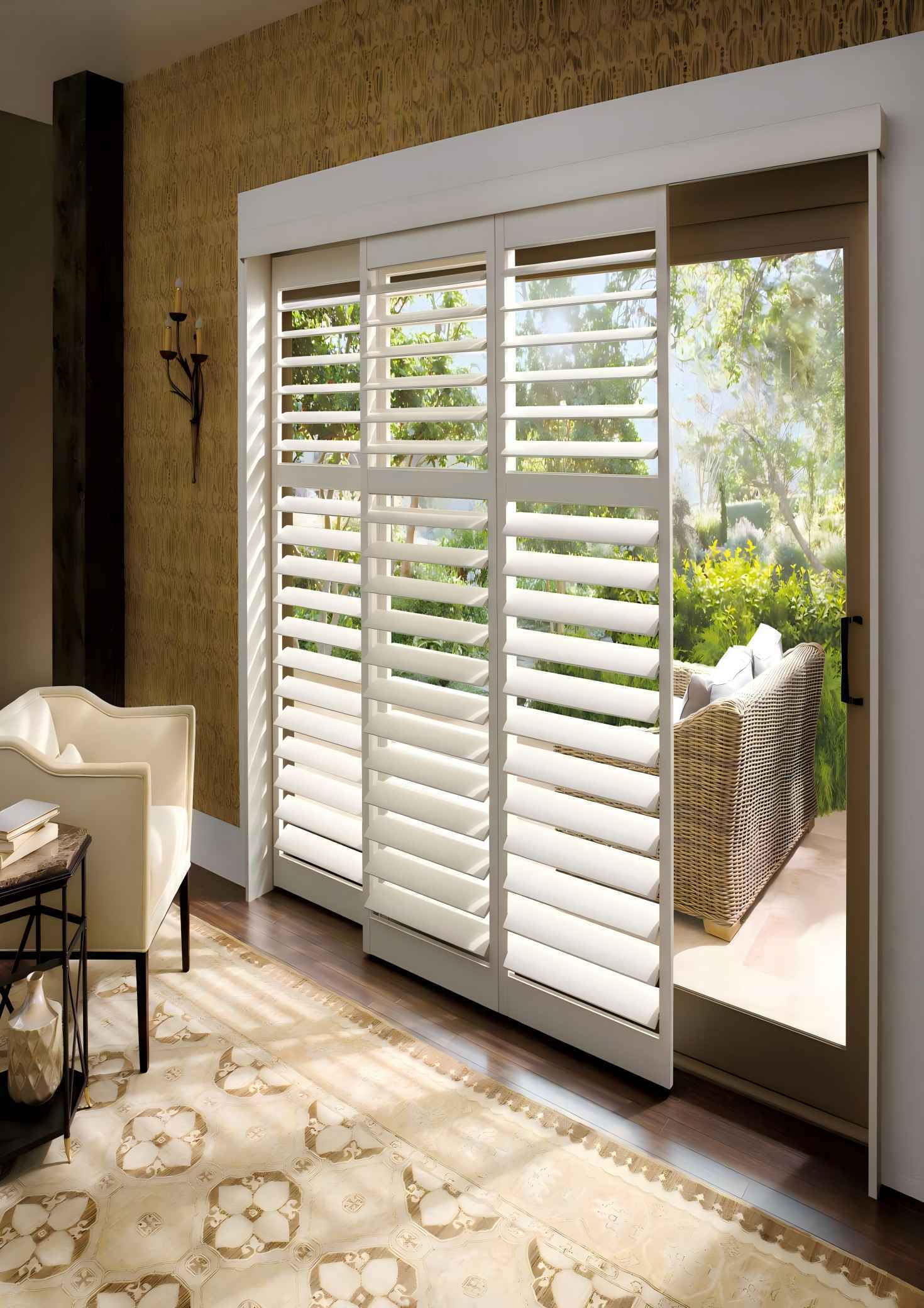 White bypass track shutters across a patio door opening