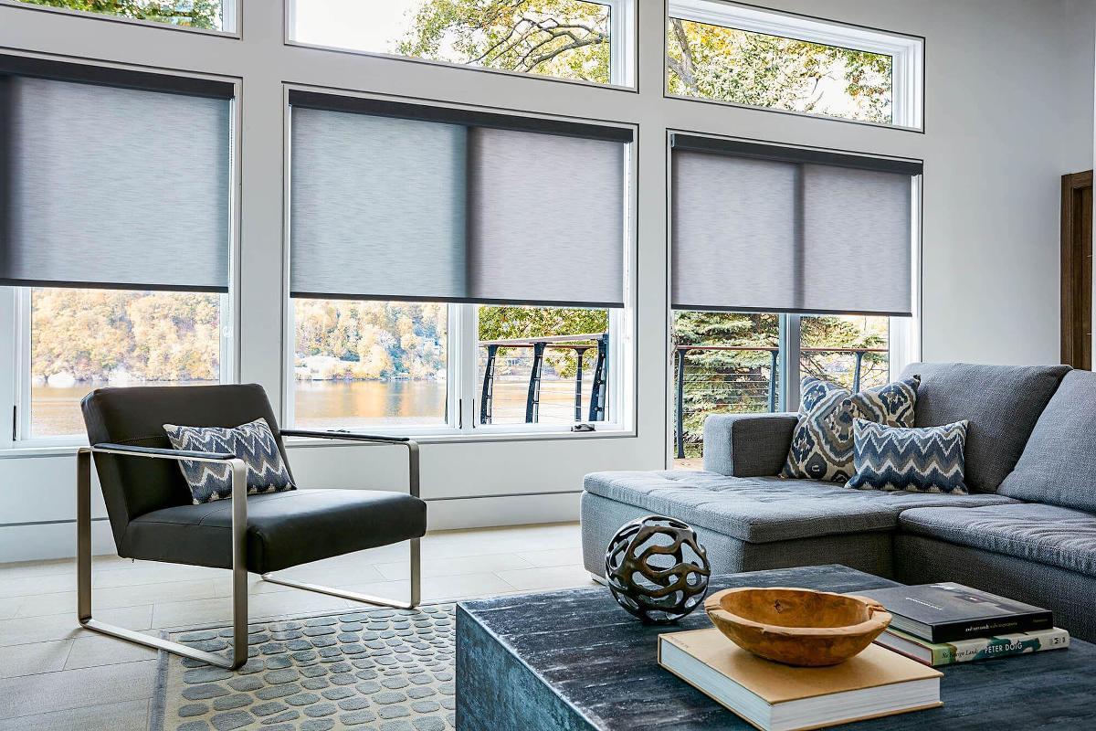 Roller shades across a wide modern living room