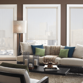 Solar shades filtering a wall of windows in a modern living room
