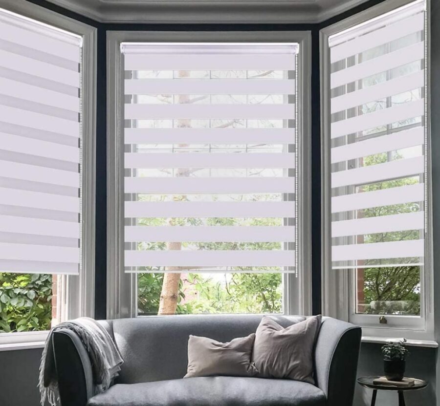Light-coloured zebra blinds with sheer bands aligned for daylight