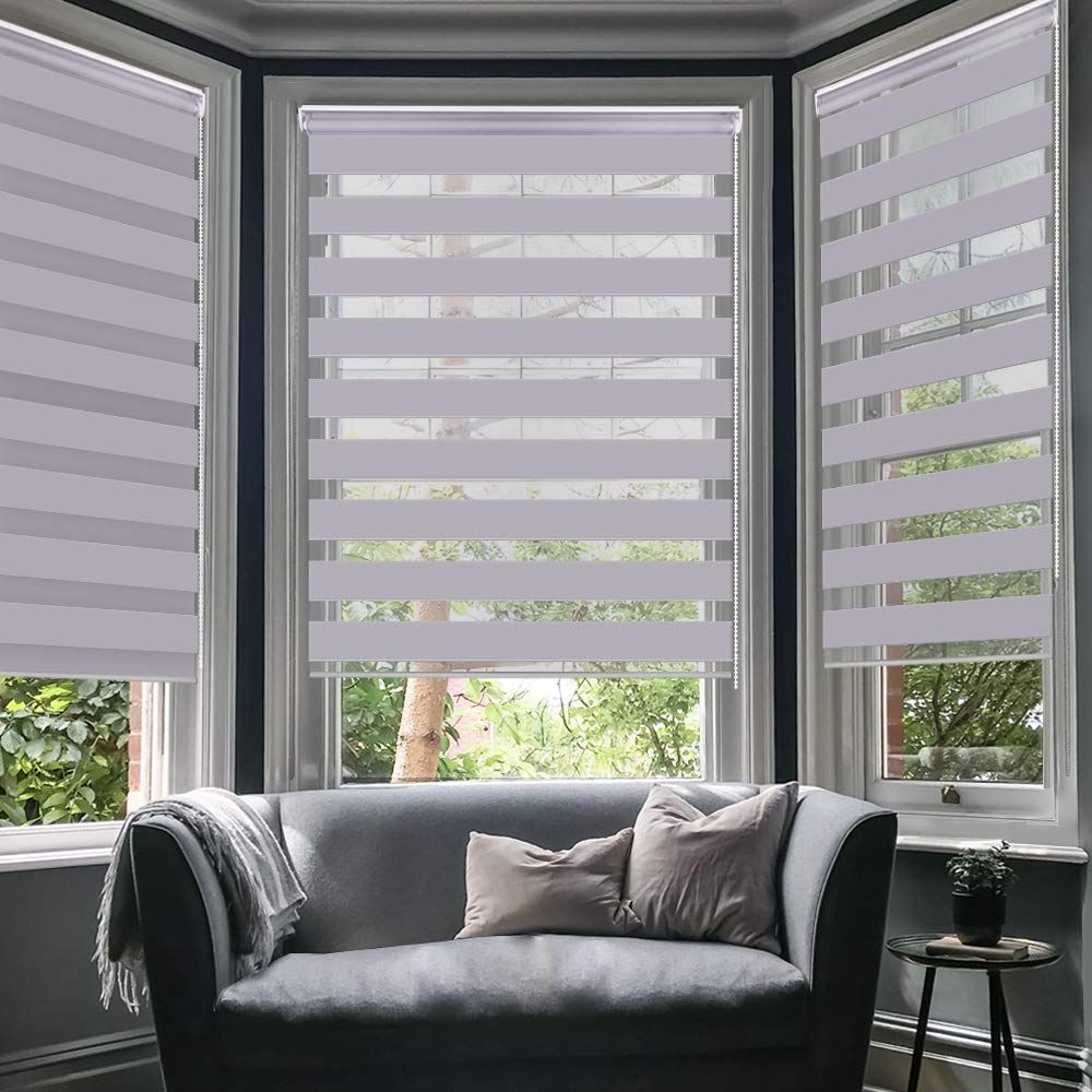 Light-filtering zebra blinds fitted to a bay window