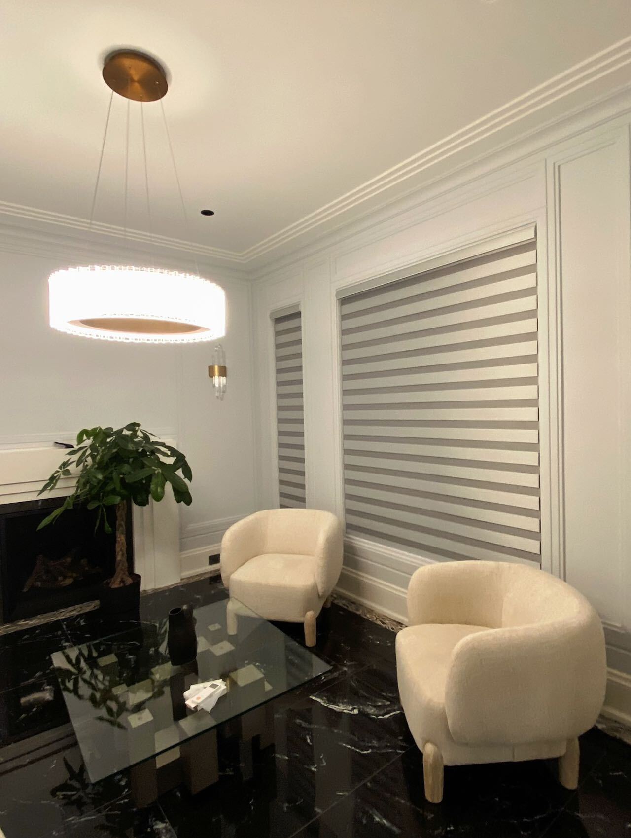 Light-filtering zebra blinds in a modern sitting room