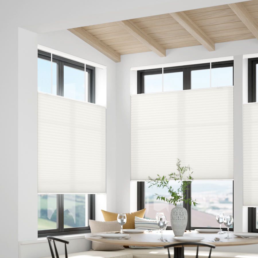 Honeycomb shades providing privacy in a dining area